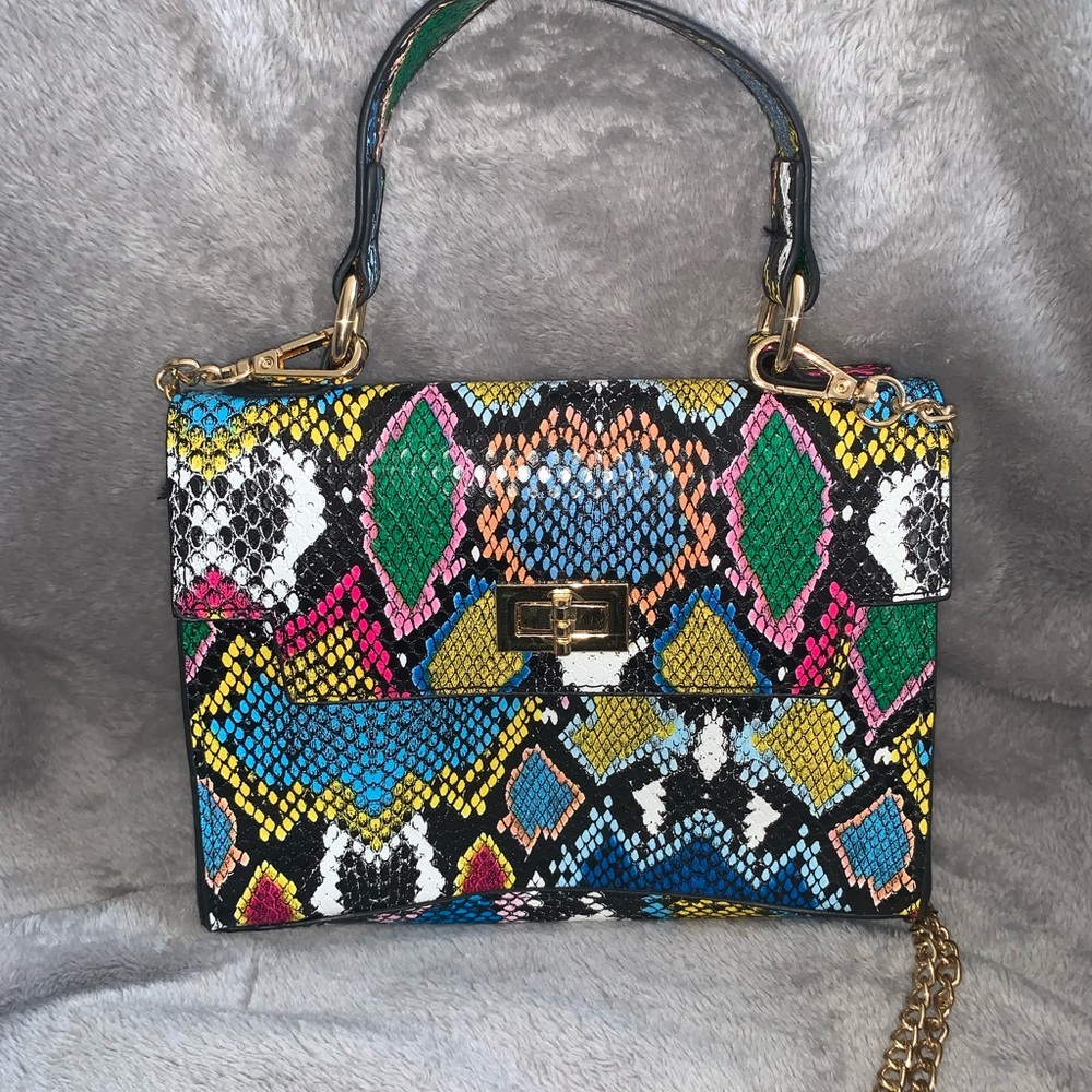 Mini snake print bag with gold chain.